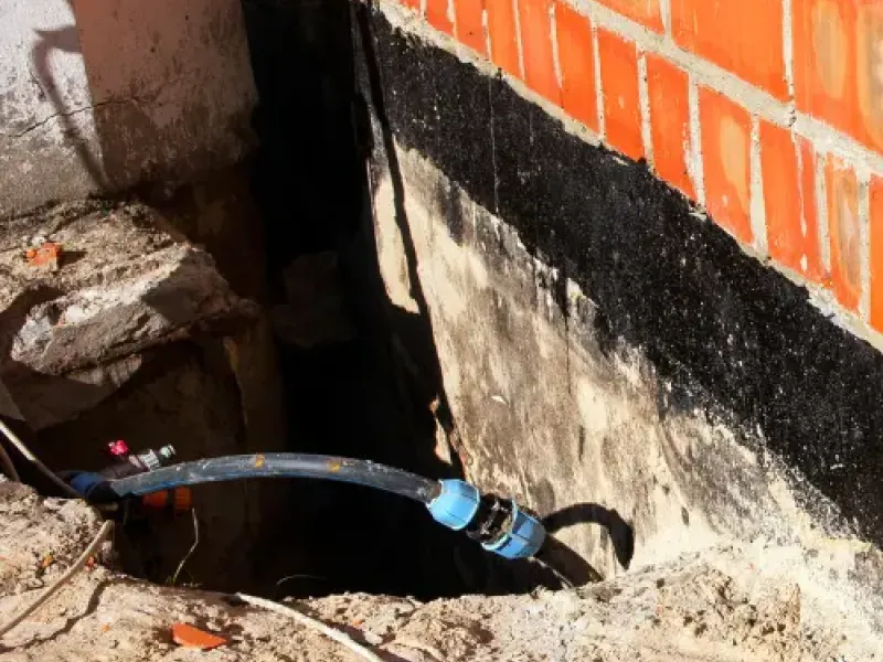 Basement waterproofing service in action.