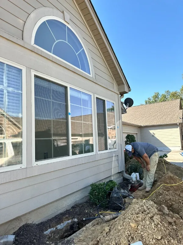 American Standard team digging under a foundation.