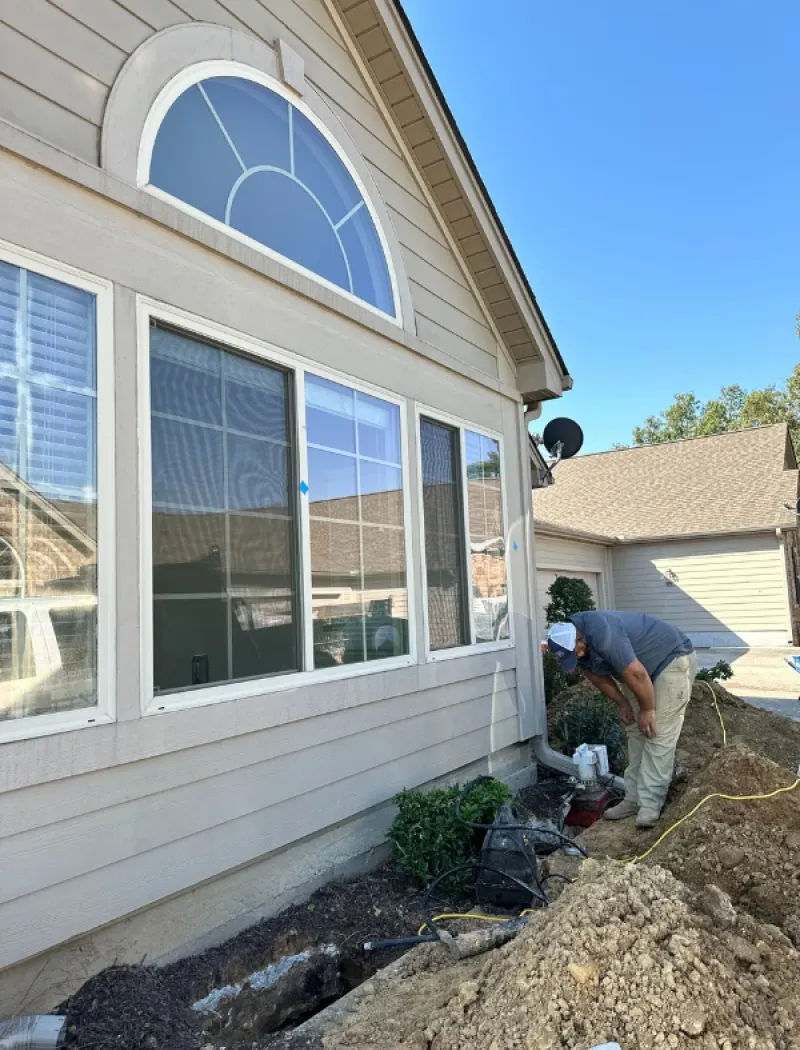 American Standard team digging under a foundation.