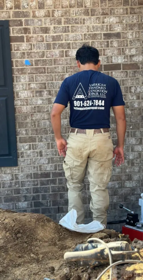 American Standard Foundation Repair employee working.