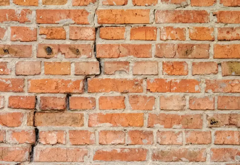 Brick wall cracking showing signs of a foundation problem.