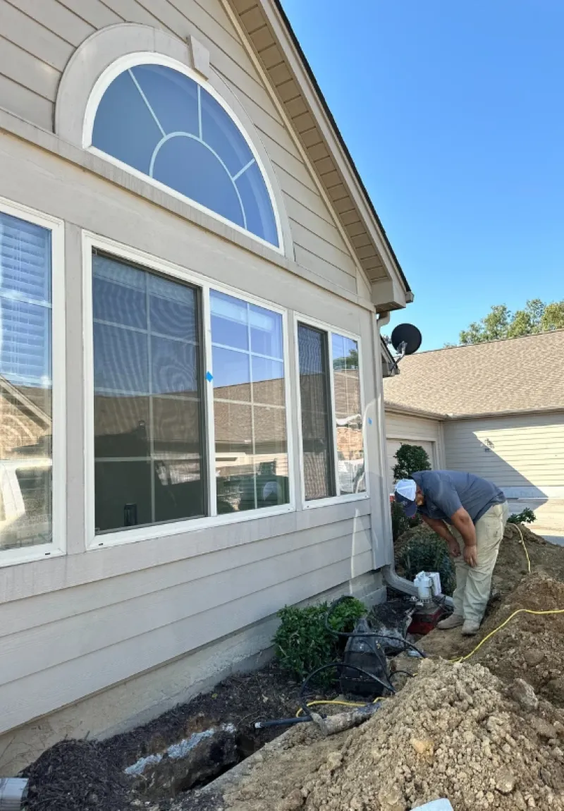 American Standard team digging under a foundation.